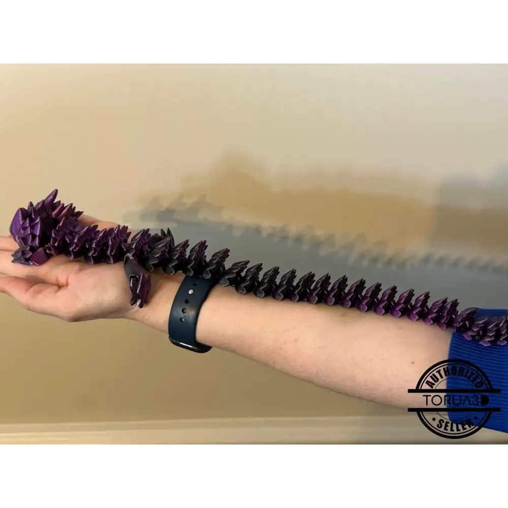 Articulated purple dragon toy.