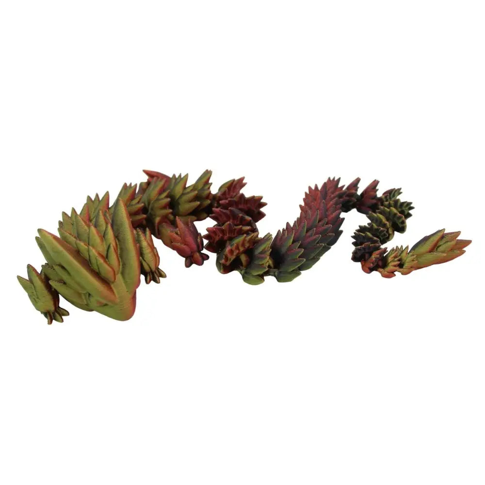 Green and red spiky dragon figurine.