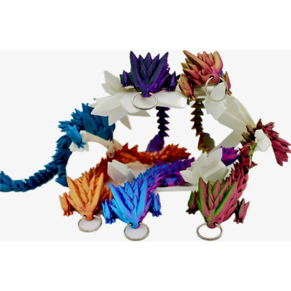 Colorful articulated dragon keychains.