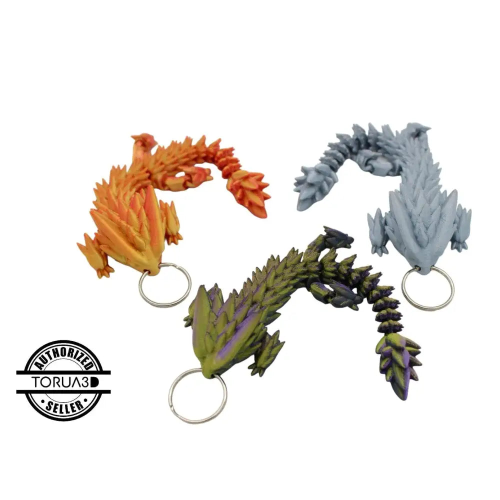 Three dragon keychains.