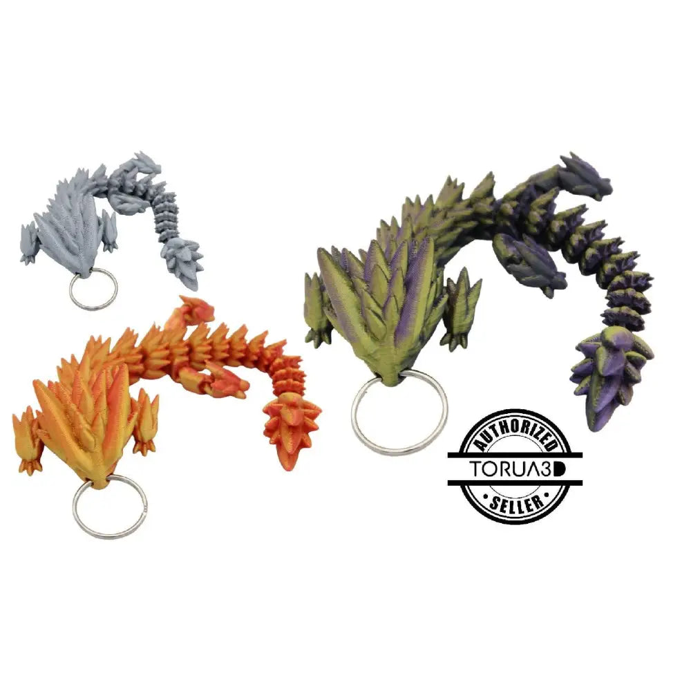 Three dragon-shaped keychains.