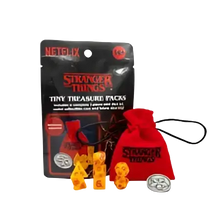 Red drawstring bag with stranger things logo and matching yellow dice in stranger things treasure packs collection