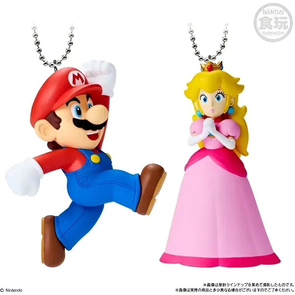 Mario in red cap and blue overalls and princess Peach in pink gown keychain figures from bandai shokugan super mario bros mascot charm collection vol 2
