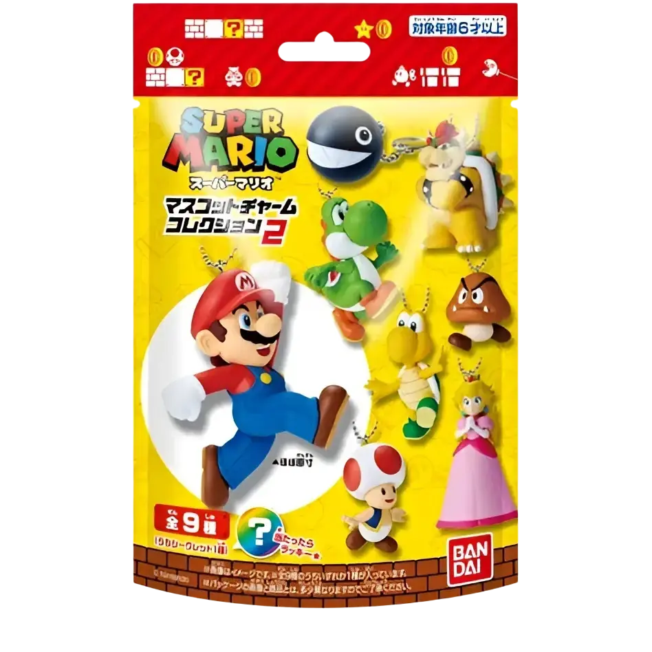 Yellow package of bandai shokugan super mario bros mascot charm collection blind bag vol 2 with mario and yoshi figurines