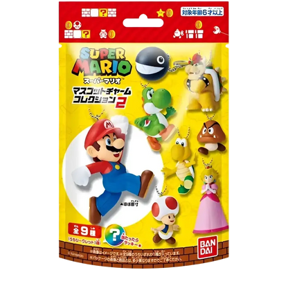 Yellow package of bandai shokugan super mario bros mascot charm collection blind bag vol 2 with mario and yoshi figurines