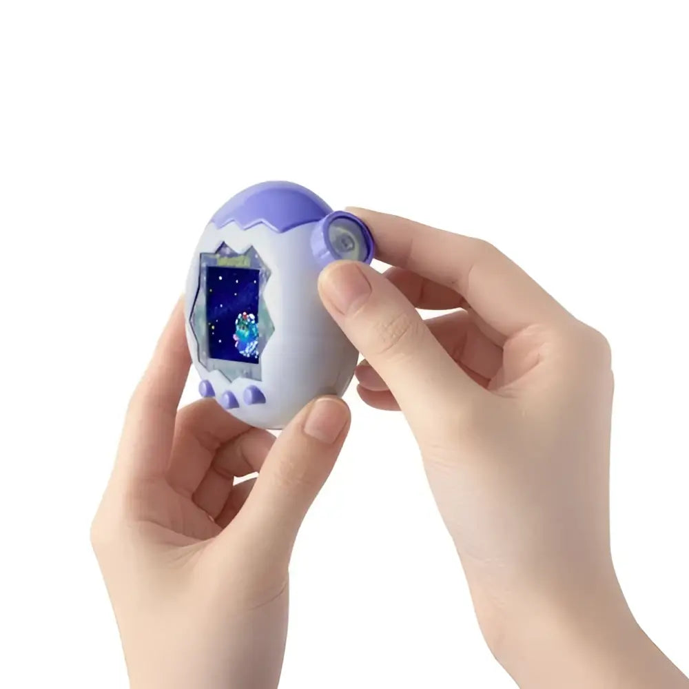 Purple and white egg-shaped tamagotchi paradise white glacier digital pet showing glowing blue creature on screen