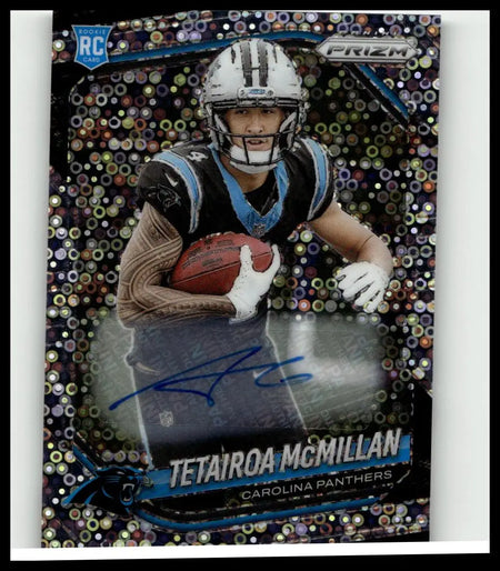A shiny holographic panini prizm rookie trading card of tetairoa mcmillan in carolina panthers uniform holding football