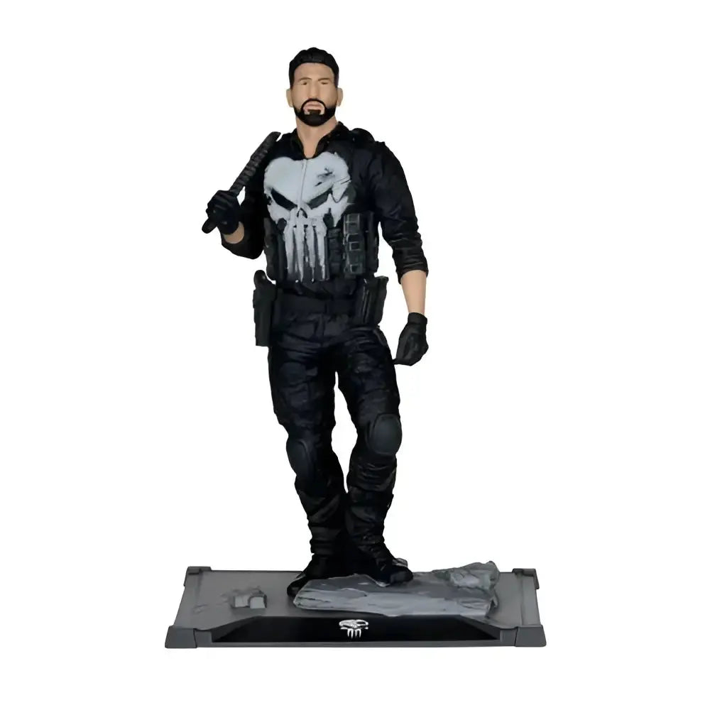 The punisher 1 10 scale posed figure features a black tactical gear action figure with a white skull emblem on a rocky base