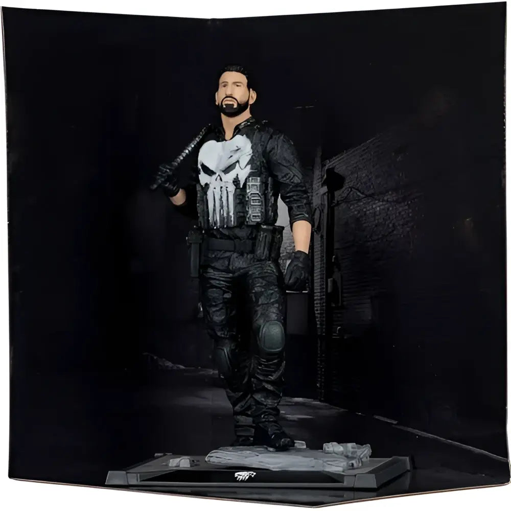 The punisher 1:10 scale posed figure in black and gray tactical gear with white skull emblem standing on detailed base