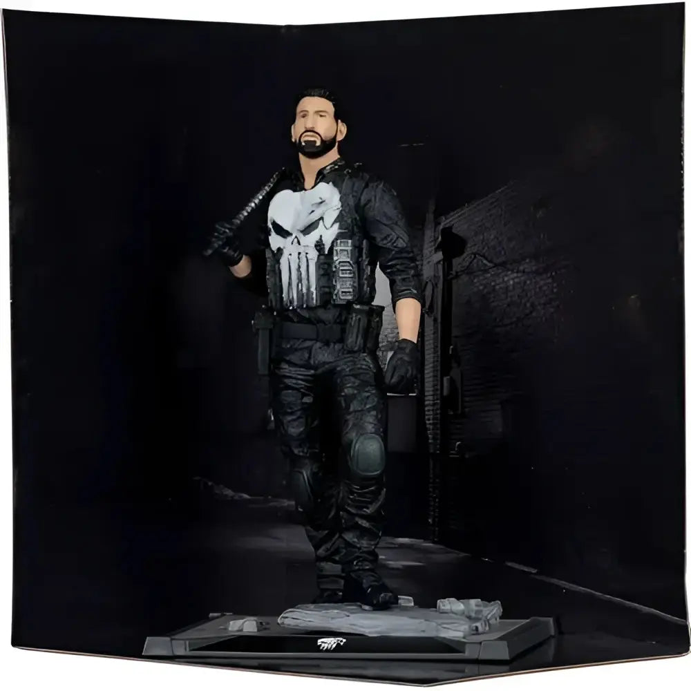 The punisher 1:10 scale posed figure in black and gray tactical gear with white skull emblem standing on detailed base