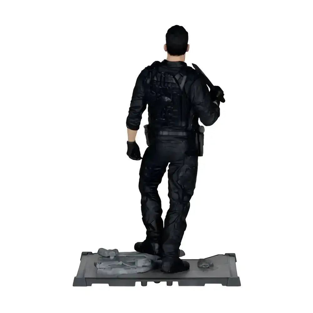 The punisher 1 10 scale posed figure in black tactical gear standing on a gray base as a scale posed figure