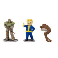 Three Fallout collectible figurines: a power-armored soldier, Vault Boy, and a deathclaw arm.