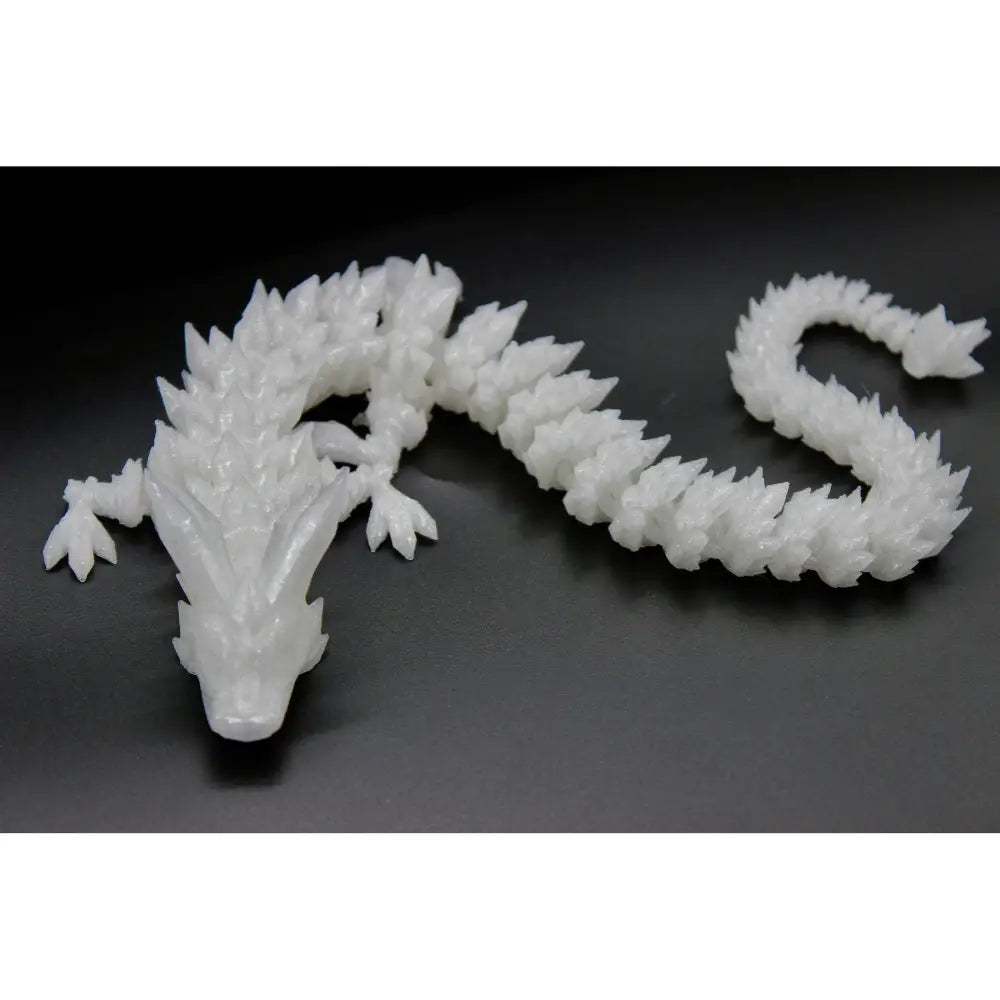 Articulated white dragon figurine.