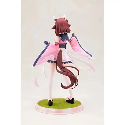 A 1 7 scale artfx statue of serena with reddish brown hair and small horns in a pink and white outfit on a green base