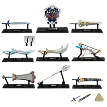 The zelda weapon collection blind box mini features detailed metallic and plastic replica weapons by bandai shokugan japan