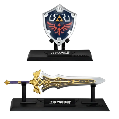 The shield is a metallic blue and silver hylian shield replica from the zelda weapon collection blind box mini by bandai shokugan japan