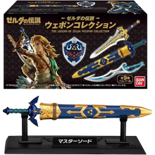 Blue and gold master sword figurine on black stand with japanese text from bandai shokugan japan zelda weapon collection blind box mini