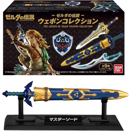 Blue and gold master sword figurine on black stand with japanese text from bandai shokugan japan zelda weapon collection blind box mini